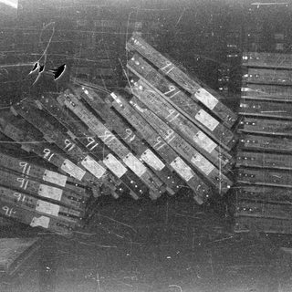 Stacks of labeled boxes in a dark space.