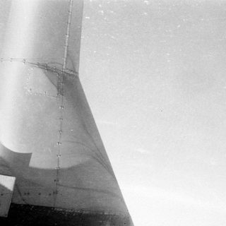 Close-up of a riveted metallic structure.