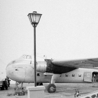 Propeller airplane EC-AEH on a tarmac.