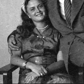 Portrait of a man in a suit and woman in a dress.