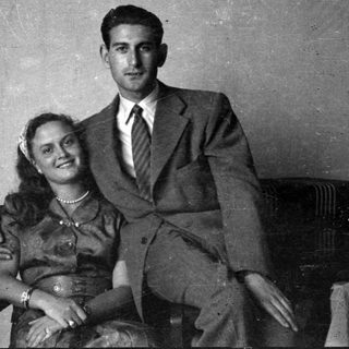 Portrait of a man in a suit and woman in a dress.