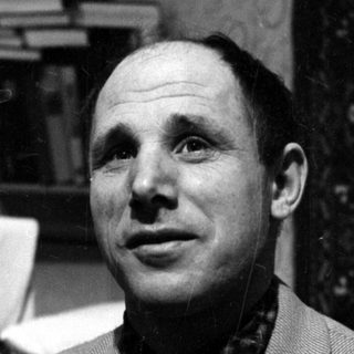 Close-up portrait of a man lying down.